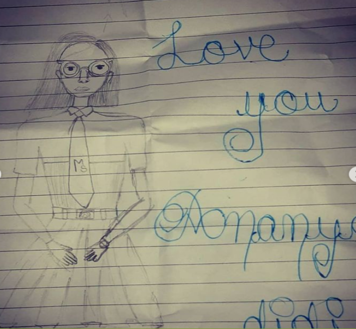 Drawing of person with words "Love you" visible at right